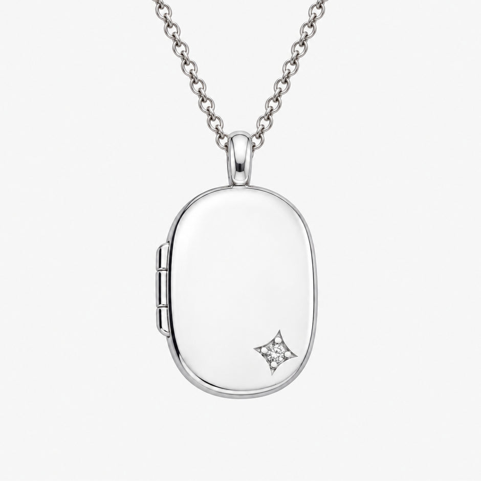 Corner Star Accent Sterling Silver Oval Locket